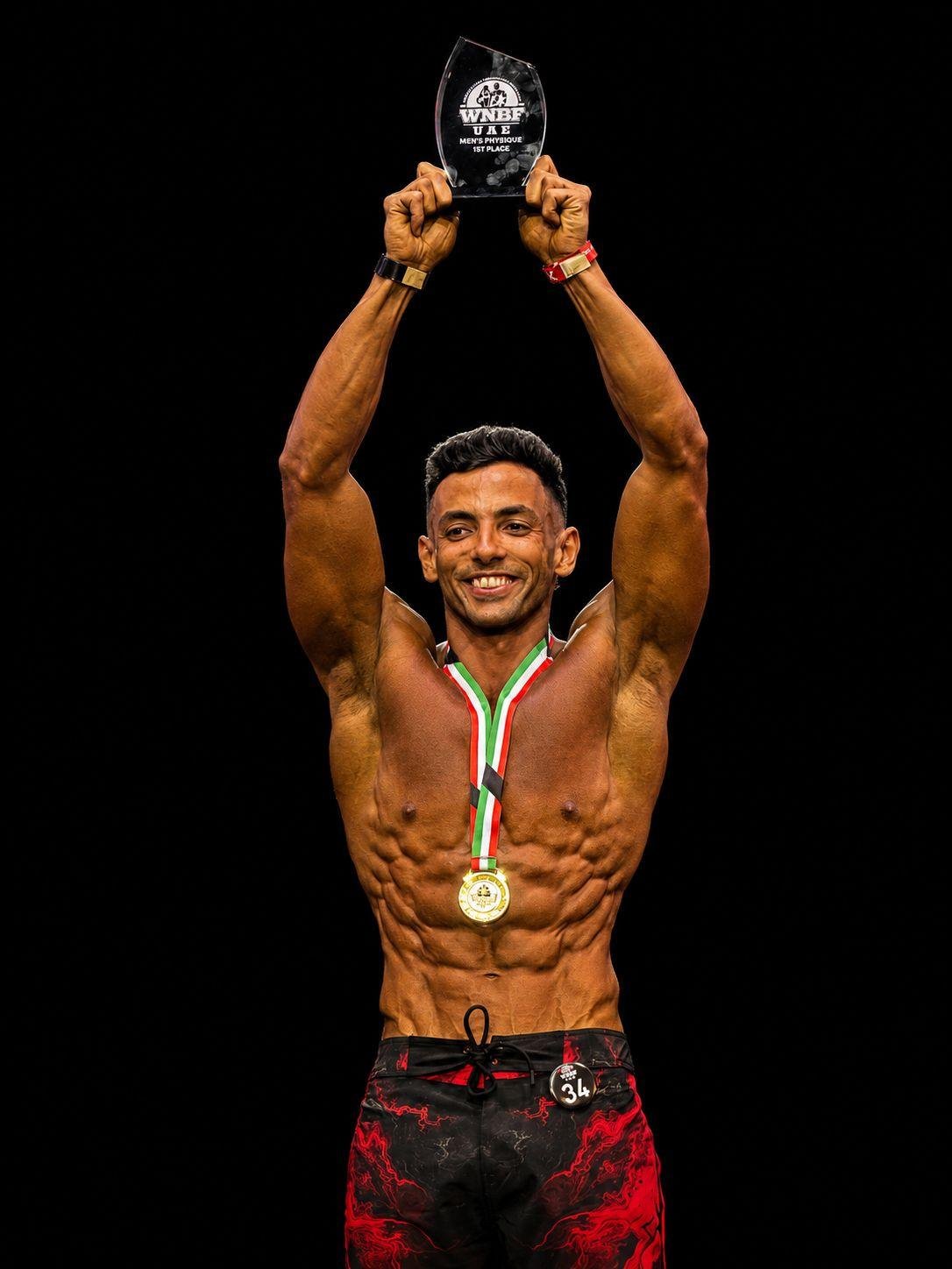 Tarek Kamsh raising his WNBF trophy